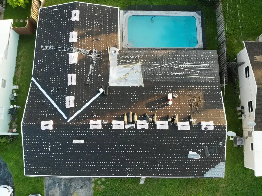 Drone view of a South Florida home mid roof replacement with underlayment down and new material going on